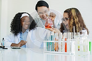 Little diversity African black and Caucasian children learning chemistry in school laboratory