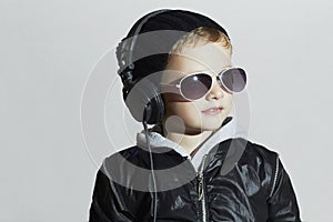 Little DJ. funny boy in sunglasses and headphones. child listening music