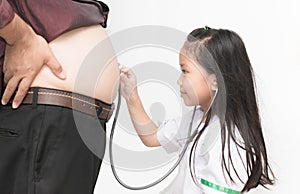 Little doctor check heart by stethoscope to obese asian man