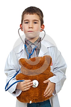 Little doctor examine bear toy