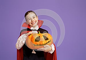 Little Dracula with a pumpkin