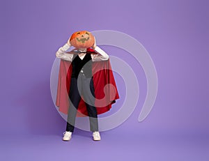 Little Dracula with a pumpkin