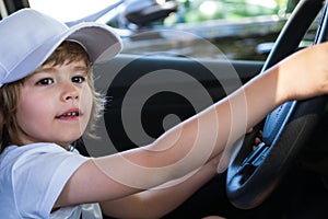 Little Driver. Cute little boy pretending to drive. Kid in car with his hands on the wheel. Child Driver. Little kid