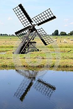 Little dutch watermill in a peat area