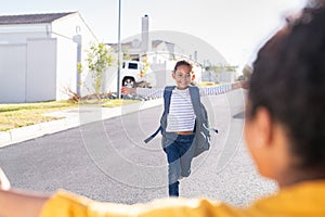 Little elementaty student girl running to mother after school