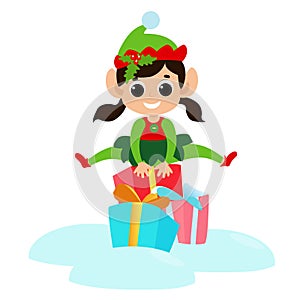 Little elf girl jumps over gift boxes. The child is happy and dressed in a traditional elf costume.