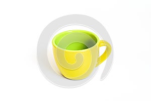 Little empty ceramic yellow and green coffee mug , coffee cup isolated on white background