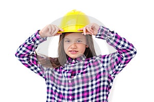 Little engineer girl with a yellow helmet isolated on white back