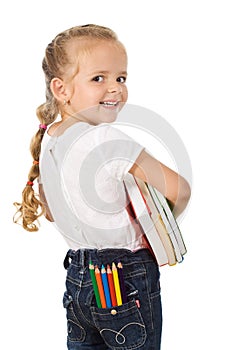 Little excited girl preparing to go back to school