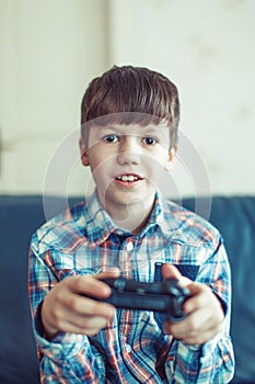 Little excited kid playing video game