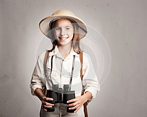 Little explorer holding binoculars photo