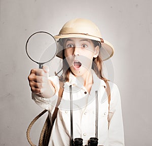 Little explorer looking through magnifying glass photo