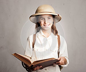 Little explorer reading a book photo