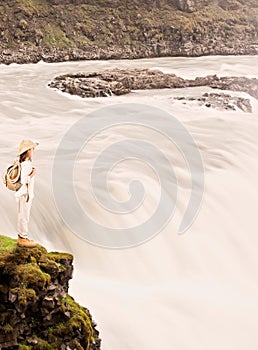 Little explorer on waterfall photo