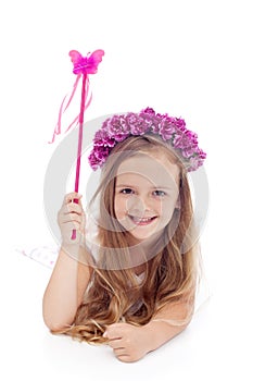 Little fairy with flower wreath and magic wand