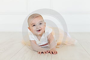 Little fairy. sweet ballerina with fluffy peach skirt and flower. Cute smiling baby girl on white studio backgroung. 6