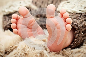 Little feet of a newborn child