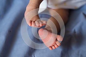 Little fingers. Legs newborn baby