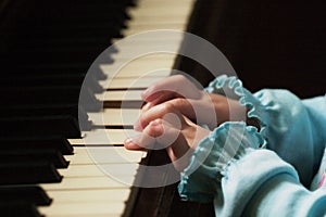 Little fingers playing the piano
