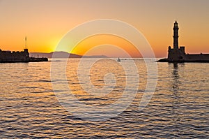 Little fishing sailboat at the entrance of harbour photo