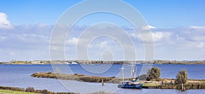 Little fishing ship in the Lauwersmeer lake in Friesland