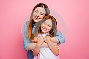 Little foxy lady holding mom`s hands enjoy meeting after summer camp wear casual clothes isolated pink background