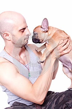 Little french bulldog puppy with a guy