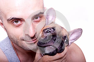 Little french bulldog puppy with a guy