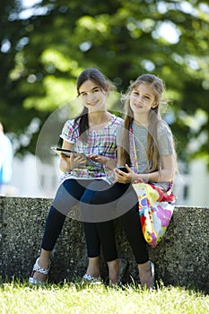 Little friends with PC tablet and mobile phone
