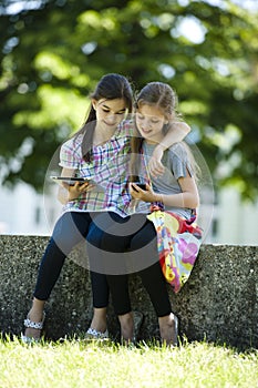 Little friends with PC tablet and mobile phone