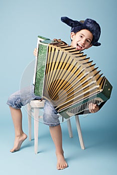 Little funny accordion player