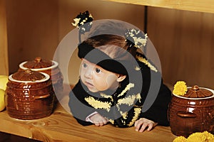 Little funny baby with bee costume