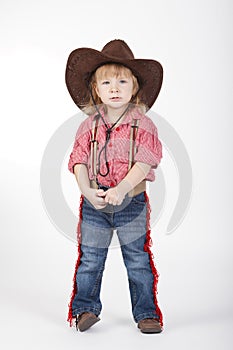Little funny cowgirl on white background