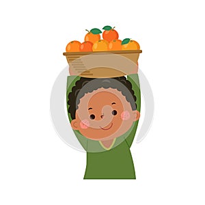 Little gardener carrying oranges fruit basket