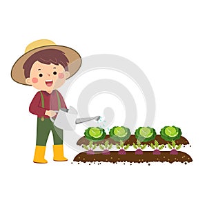 Little gardener watering vegetables in garden