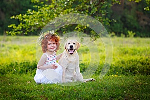 LIttle ginger girl and big dog bestfriend on nature background