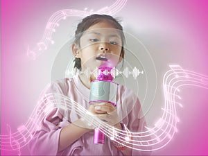 Little girl 5 years old sing a song with melodies. Childhood lifestyle concept. A kid or child enjoys singing in microphone