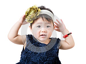 Little girl adjust hair accessory