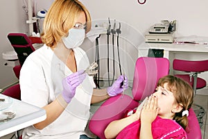 Little girl is afraid of the dentist