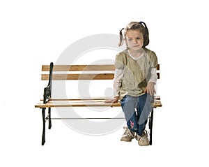 Little girl alone on bench