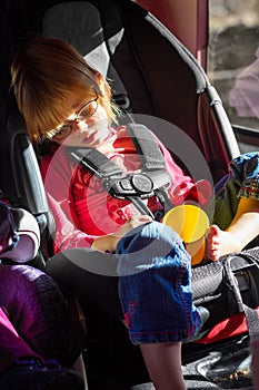 Little Girl Asleep and Drooling in Her Carseat on a Roadtrip