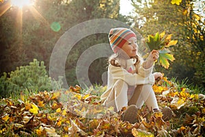 Little girl in an autumn park