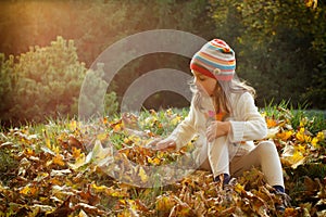 Little girl in an autumn park