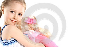 Little girl with baby doll toy