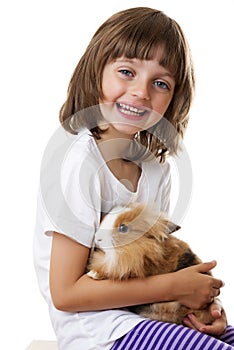 Little girl with baby rabbit