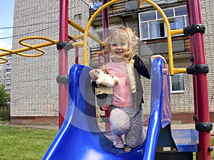 The little girl in a baby swing