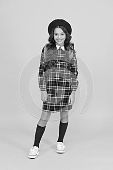 little girl with backpack going to school. education concept. school and fashion. child in pupil uniform. kid in french