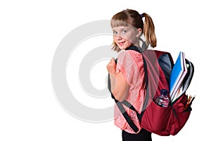 Little girl with backpack with school supplies smiling isolated