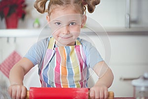 Little girl baking Christmas cookies at home