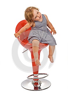 Little girl on bar stool posing - isolated